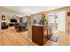 Open concept kitchen featuring stainless steel appliances, hardwood floors and breakfast nook at 4814 Monarch Dr, Firestone, CO 80504