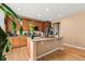 Kitchen island with granite countertops, wood cabinetry, and stainless steel appliances at 4814 Monarch Dr, Firestone, CO 80504