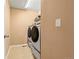 Functional laundry room featuring modern washer and dryer units, and neutral wall paint at 4814 Monarch Dr, Firestone, CO 80504