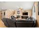 Relaxing living room features hardwood floors, a fireplace, and a comfortable leather sectional at 4814 Monarch Dr, Firestone, CO 80504