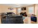 Cozy living room with plush seating, hardwood floors, and a modern entertainment center for a relaxing atmosphere at 4814 Monarch Dr, Firestone, CO 80504