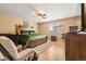 Comfortable bedroom featuring a large bed, wood floors, and a ceiling fan at 4814 Monarch Dr, Firestone, CO 80504