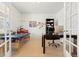 Bright office space, versatile as a flex room, with tile floors and glass French doors at 4814 Monarch Dr, Firestone, CO 80504