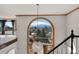 Bright foyer featuring a grand window with mountain views and a decorative chandelier at 19575 Misty Morning Dr, Monument, CO 80132