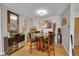 Dining area with glass-top table and four chairs at 3164 S Wheeling Way # 306, Aurora, CO 80014