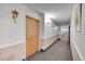 Building hallway with carpeted floors and light walls at 3164 S Wheeling Way # 306, Aurora, CO 80014