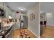 Galley kitchen with stainless steel appliances and light cabinets at 3164 S Wheeling Way # 306, Aurora, CO 80014