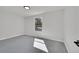 Bright bedroom with large window and neutral carpet at 6485 S Havana St # A, Englewood, CO 80111