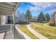 Exterior view of apartments with sidewalks, landscaping, and a porch view of the neighborhood at 6485 S Havana St # A, Englewood, CO 80111