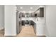 Bright kitchen with updated stainless steel appliances and modern countertops at 6485 S Havana St # A, Englewood, CO 80111
