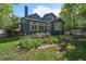 Exterior view of the house from the backyard with a dining area and plenty of natural light at 10610 Winterflower Way, Parker, CO 80134