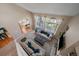Open concept living room with great natural light and a view to the kitchen at 10610 Winterflower Way, Parker, CO 80134