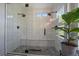 Contemporary walk-in shower featuring dual shower heads and a built in bench at 10610 Winterflower Way, Parker, CO 80134