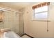 Modern bathroom with glass shower, and bright window providing natural light at 10902 Bannock St, Northglenn, CO 80234