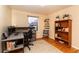 Comfortable bedroom featuring a desk, bookshelf, and a window for natural lighting at 10902 Bannock St, Northglenn, CO 80234