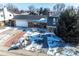 Charming brick home featuring a well-maintained lawn, mature trees, and a cozy front porch at 10902 Bannock St, Northglenn, CO 80234
