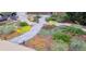 Beautifully landscaped front yard with a stone pathway and vibrant plants at 10902 Bannock St, Northglenn, CO 80234