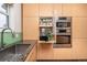 Functional kitchen with stainless steel appliances, stylish cabinets, and efficient storage solutions for an organized culinary space at 10902 Bannock St, Northglenn, CO 80234