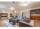 Basement area with fireplace, a large sofa, and a display of board games at 10902 Bannock St, Northglenn, CO 80234