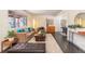 Comfortable living room with a sofa, stylish rug, and ample natural light at 10902 Bannock St, Northglenn, CO 80234