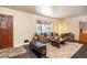 Cozy living room with a comfortable sofa, stylish rug, and ample natural light at 10902 Bannock St, Northglenn, CO 80234