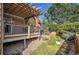 Exterior of deck and back yard with various plants and rock ground cover at 14200 Lakeview Ln, Broomfield, CO 80023