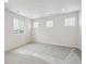 Bright bedroom with neutral carpeting and large window at 819 Goodrich Peak St, Erie, CO 80516