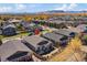 Aerial view of a residential neighborhood showing well-maintained homes, landscaping, and mountain views at 14921 W 70Th Ave, Arvada, CO 80007