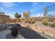 Well maintained backyard with gravel, patio, and lush green space at 14921 W 70Th Ave, Arvada, CO 80007