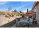 Backyard features a patio with outdoor seating, a BBQ, and a beautifully landscaped area at 14921 W 70Th Ave, Arvada, CO 80007