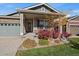 Charming single-Gathering home with a well-manicured front yard and stone accents at 14921 W 70Th Ave, Arvada, CO 80007