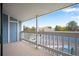 View from the balcony with white railings overlooking the parking lot and neighboring buildings at 8335 Fairmount Dr # 9-206, Denver, CO 80247