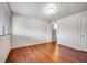 Spacious bedroom features hardwood flooring and lots of natural light through a window at 8335 Fairmount Dr # 9-206, Denver, CO 80247