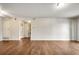Spacious living room with wood floors, neutral walls, and ample space for furniture arrangement at 8335 Fairmount Dr # 9-206, Denver, CO 80247