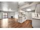 Open living space combining kitchen and living room, featuring a fireplace, balcony, and modern fixtures at 8335 Fairmount Dr # 9-206, Denver, CO 80247