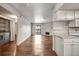 Open living space with laundry, a modern kitchen, a fireplace, and balcony access at 8335 Fairmount Dr # 9-206, Denver, CO 80247