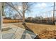 Spacious backyard with a concrete patio and a large tree, perfect for outdoor living at 127 Emerald St, Broomfield, CO 80020