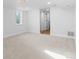 This finished basement offers a versatile space with carpet floors and natural light at 127 Emerald St, Broomfield, CO 80020