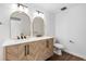Modern bathroom featuring double vanity with unique wood grain, gold accents, and sleek fixtures at 127 Emerald St, Broomfield, CO 80020
