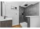 Modern bathroom with a sleek vanity, contemporary fixtures, and a glass-enclosed shower at 127 Emerald St, Broomfield, CO 80020