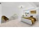 Modern bedroom with a stylish bed, chic decor, and natural lighting at 127 Emerald St, Broomfield, CO 80020