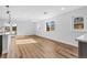 Spacious, bright living room featuring wood floors and large windows for ample natural light at 127 Emerald St, Broomfield, CO 80020