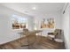 Bright home office featuring hardwood floors, a modern desk, and comfortable seating at 127 Emerald St, Broomfield, CO 80020