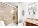 A bathroom with modern shower, glass door, a sink with wood vanity, and a floating mirror at 1313 N Williams St # 1003, Denver, CO 80218