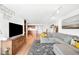 Open-concept living room showcasing a sectional sofa and connection to the dining and kitchen areas at 1313 N Williams St # 1003, Denver, CO 80218