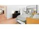 The main bedroom boasts light hardwood floors and a closet with mirrored sliding doors at 1313 N Williams St # 1003, Denver, CO 80218