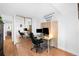 The office features hardwood floors, a sliding mirror closet, and a computer setup at 1313 N Williams St # 1003, Denver, CO 80218