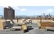 This rooftop patio features lounge chairs and stunning city views at 1313 N Williams St # 1003, Denver, CO 80218