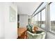 Inviting sun room with comfortable chairs, large windows, and city views at 1313 N Williams St # 1003, Denver, CO 80218