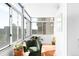 Bright and airy sun room with large windows offering views of the city at 1313 N Williams St # 1003, Denver, CO 80218